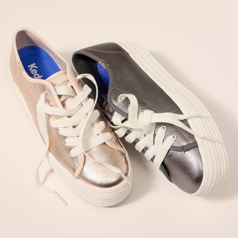 A pair of Triple Up Metallic Leather Platform Lace-Up Sneakers, one in gold and the other in gunmetal.