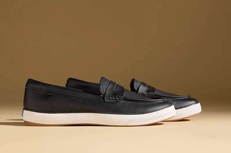 A side view of the Center Leather Loafer Sneakers in black.