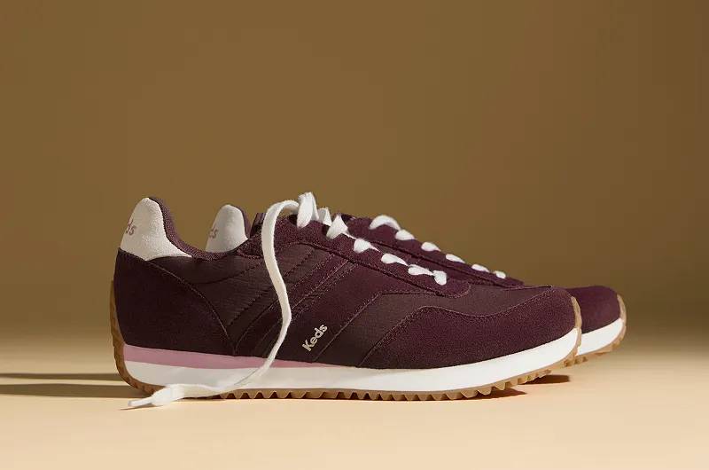 A side view of the Rena Nylon/Suede Lace-Up Sneakers in burgundy.