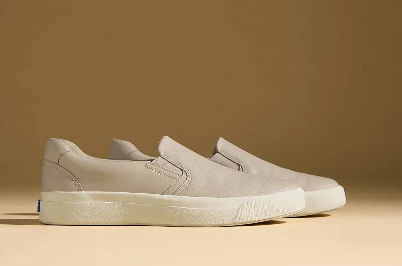A side view of the Pursuit Leather Slip-On Sneakers in oatmeal.